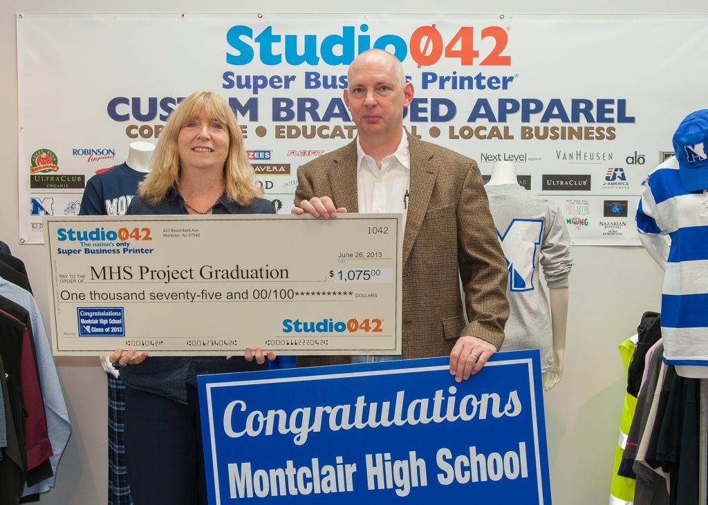 Scott Kennedy from Studio042 presenting a donation for Project Graduation 2014.