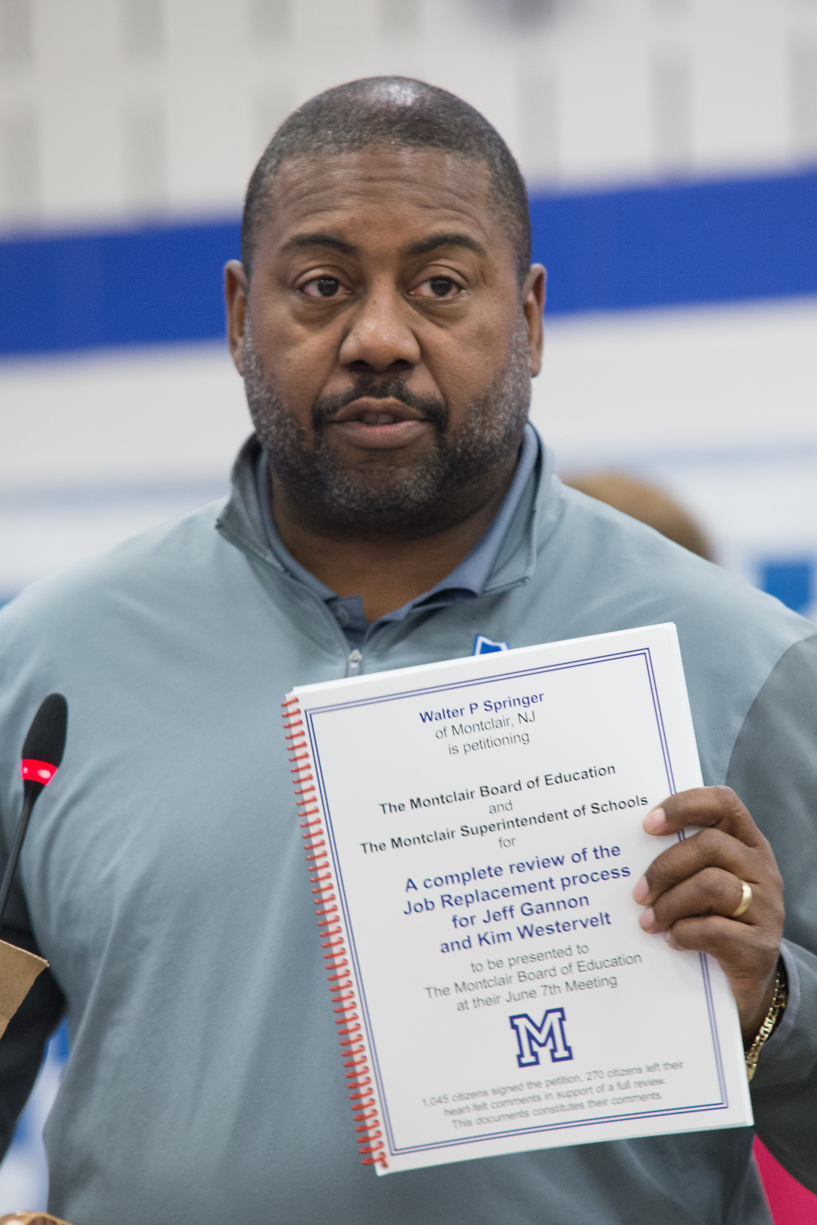Walter Springer with a copy of his petition in hand. Photo by Tony Turner for The Montclair Dispatch.